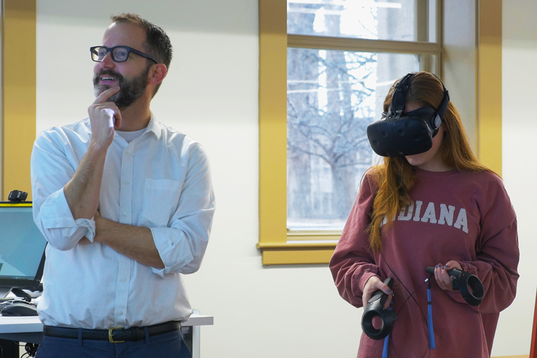 Professor Racek and a student wearing a virtual reality headset