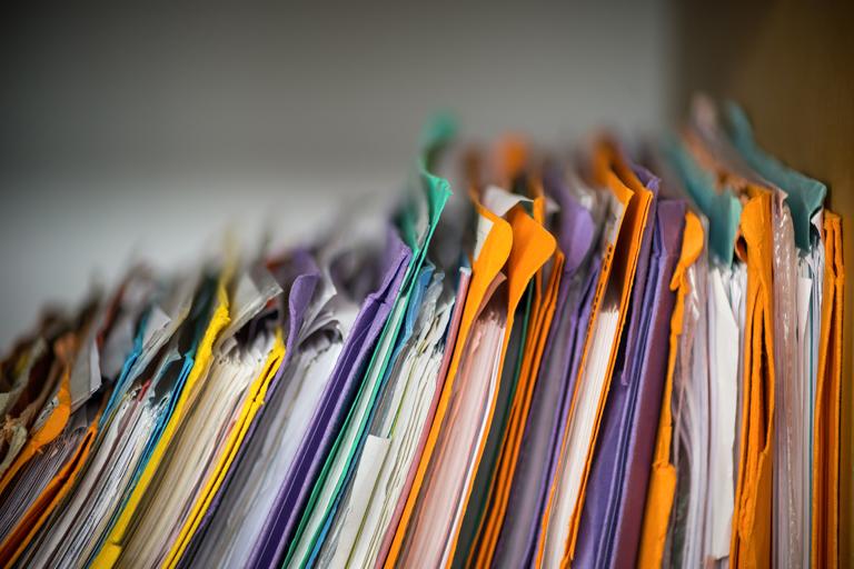 close-up of colorful, filled file folders