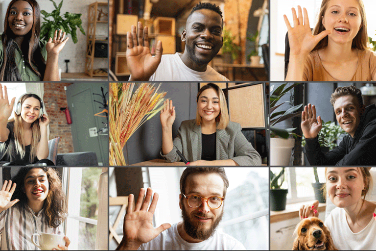 Screenshot of an online meeting with many people smiling. Some are waving. 