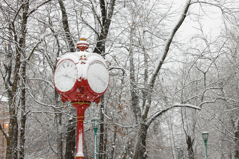 snow-covered red clock on the IU Bloomington campus